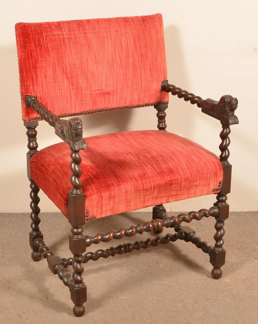Jacobean Style Walnut Frame Upholstered Armchair.: Jacobean Style Walnut Frame Upholstered Armchair. Carved reclining lion knuckles. 34-1/2" high overall. Condition: Good with wear.