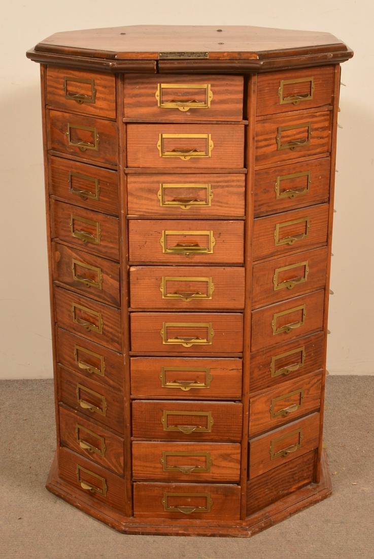 Antique Mixedwood Octagonal Hardware Cabinet Top.: Antique Mixedwood Octagonal Hardware Cabinet Top. Labeled "The American Bolt & Screw Case Co., Dayton, OH". 33"h. x 21-1/2" diam. Condition: Good with Cracks and wear. Top only, missing the base that