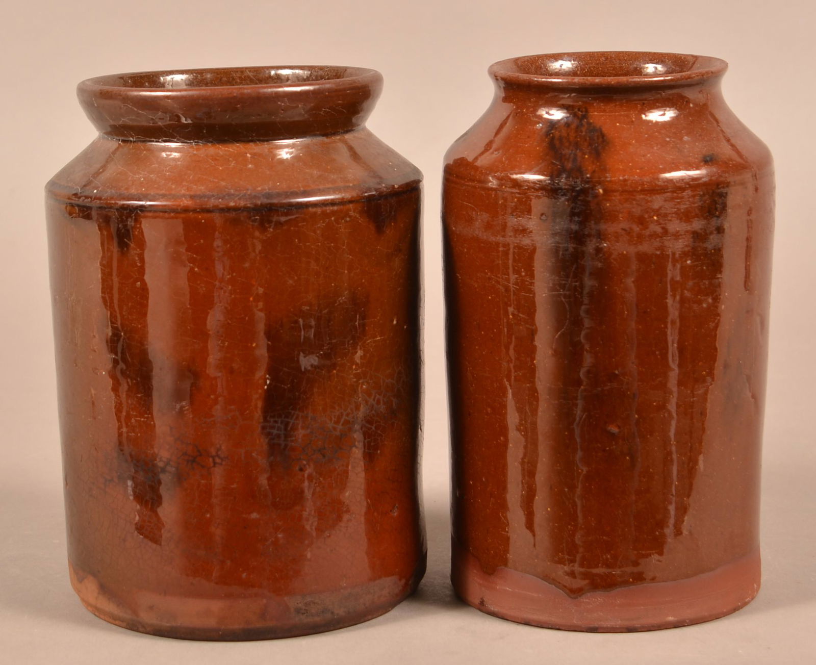 Two Antique Mottle Glazed Redware Storage Jars.: Two Antique Mottle Glazed Redware Storage Jars. 8-1/4"h. Condition: Good with use wear.
