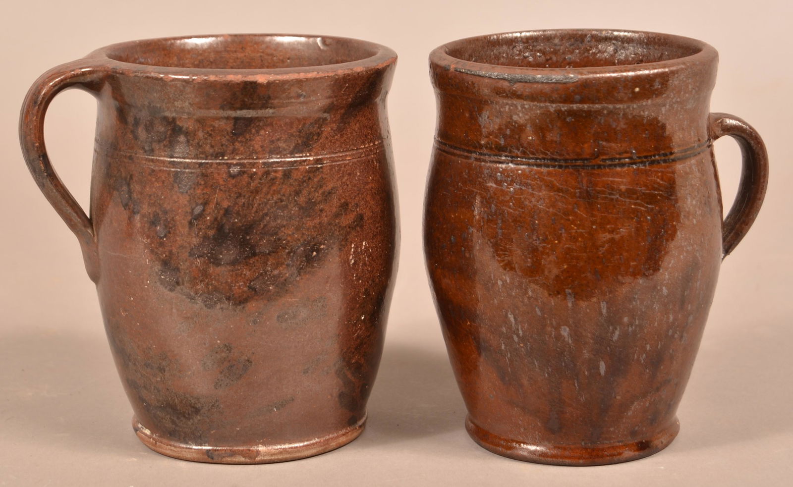 Two PA Redware Mottle Glazed Apple Butter Crocks.: Two Pennsylvania 19th Century Redware Mottle Glazed Apple Butter Crocks. Both approximately 6"h. Condition: Good with minor pin nips and glaze wear.