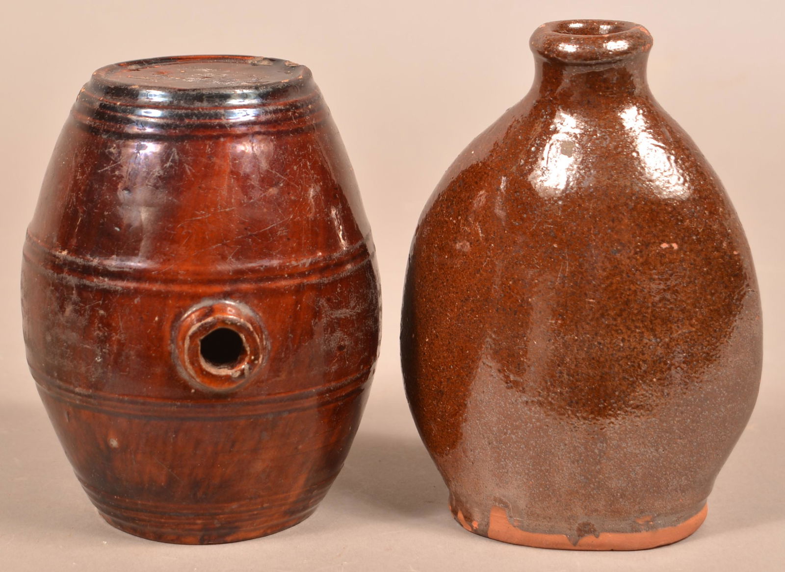 Antique Glazed Redware Flask and Brandy Keg.: Antique Glazed Redware Flask and Brandy Keg. 6-1/2" and 7"h. Condition: Good with chips and wear.