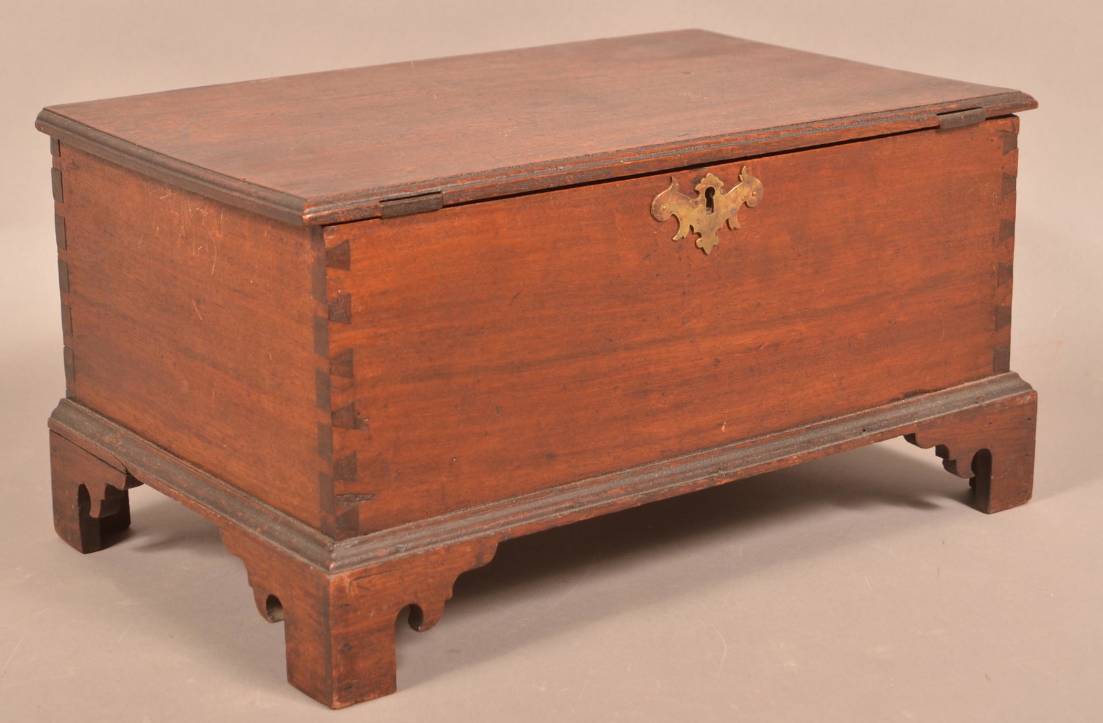 Pennsylvania Chippendale Walnut Bible Box.: Pennsylvania Chippendale Walnut Bible Box. Molded lid with batten supports, interior till, dovetailed case with brass bat-wing key escutcheon, molded base with bracket feet having bird head spurs. 9-1