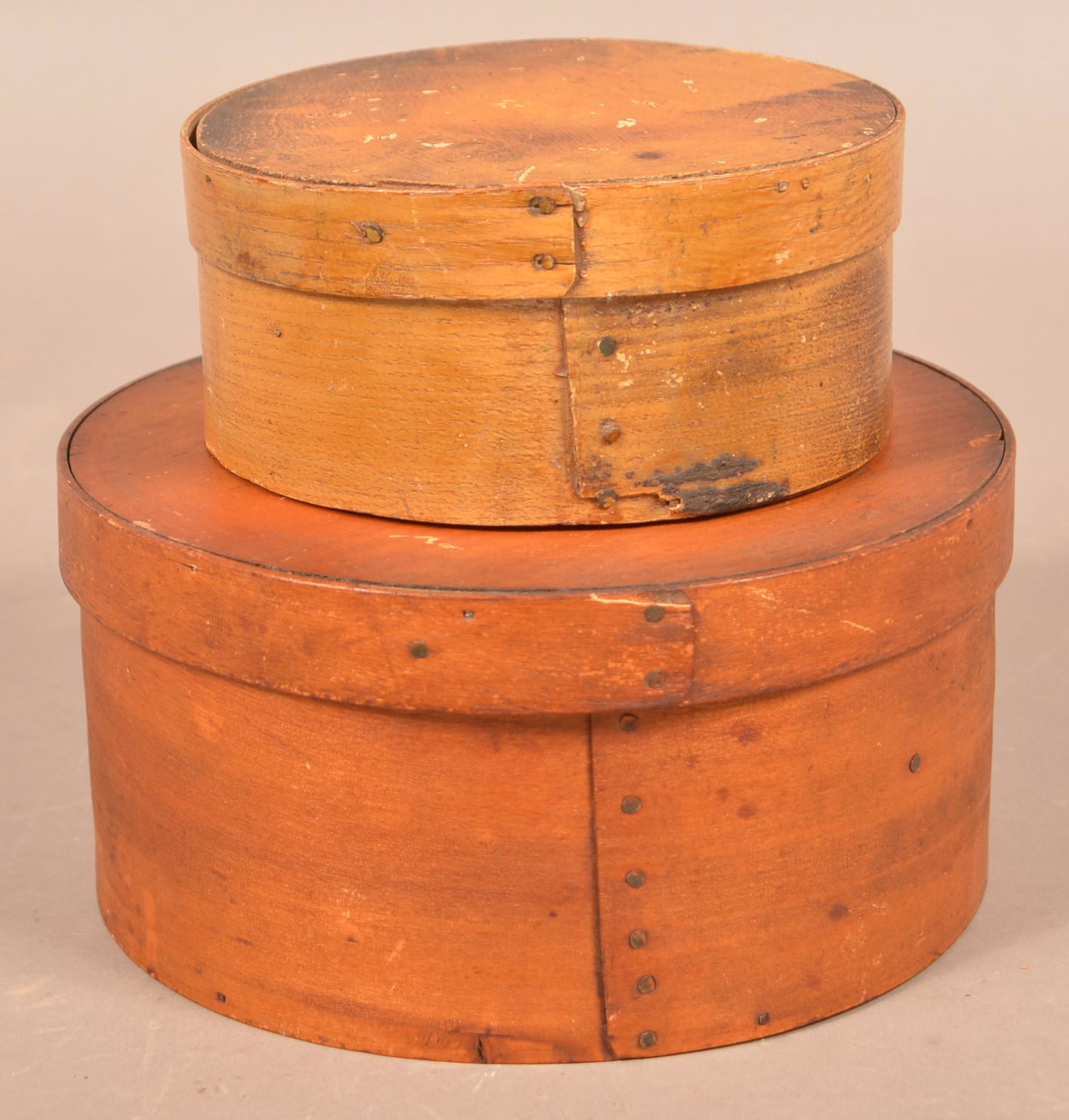Two Pennsylvania 19th Century Bentwood Pantry Boxes.: Two Pennsylvania 19th Century Bentwood Pantry Boxes. Original paint with copper tack supports. Yellow/tan 3"h. x 6-1/2" diam. Ochre 4-1/2"h. x 9" diam. Condition: Good with wear and minor loss.