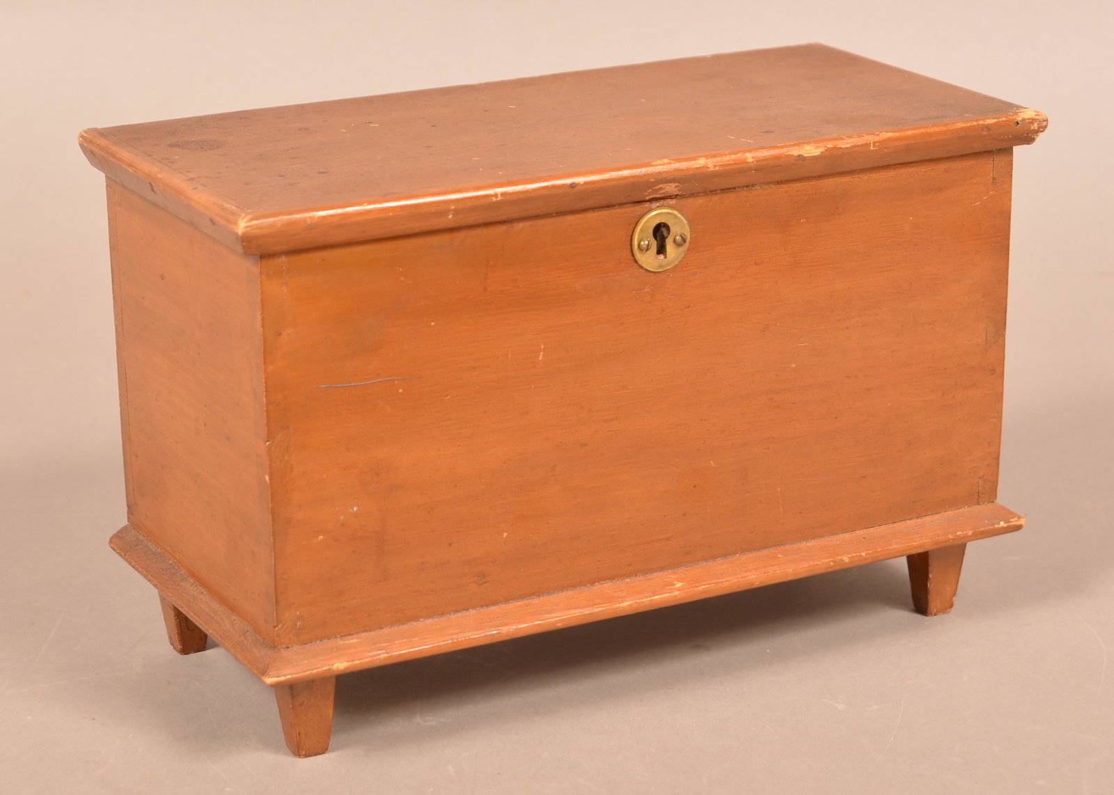 Antique Softwood Miniature Blanket Chest.: Antique Softwood Miniature Blanket Chest. Molded lid, dovetailed case and tapered feet. Inscribed under lid "Made by Josiha Fisher, Anno 1905". With the original brown finish. 6-3/4"h. x 10-3/4"w. x 5