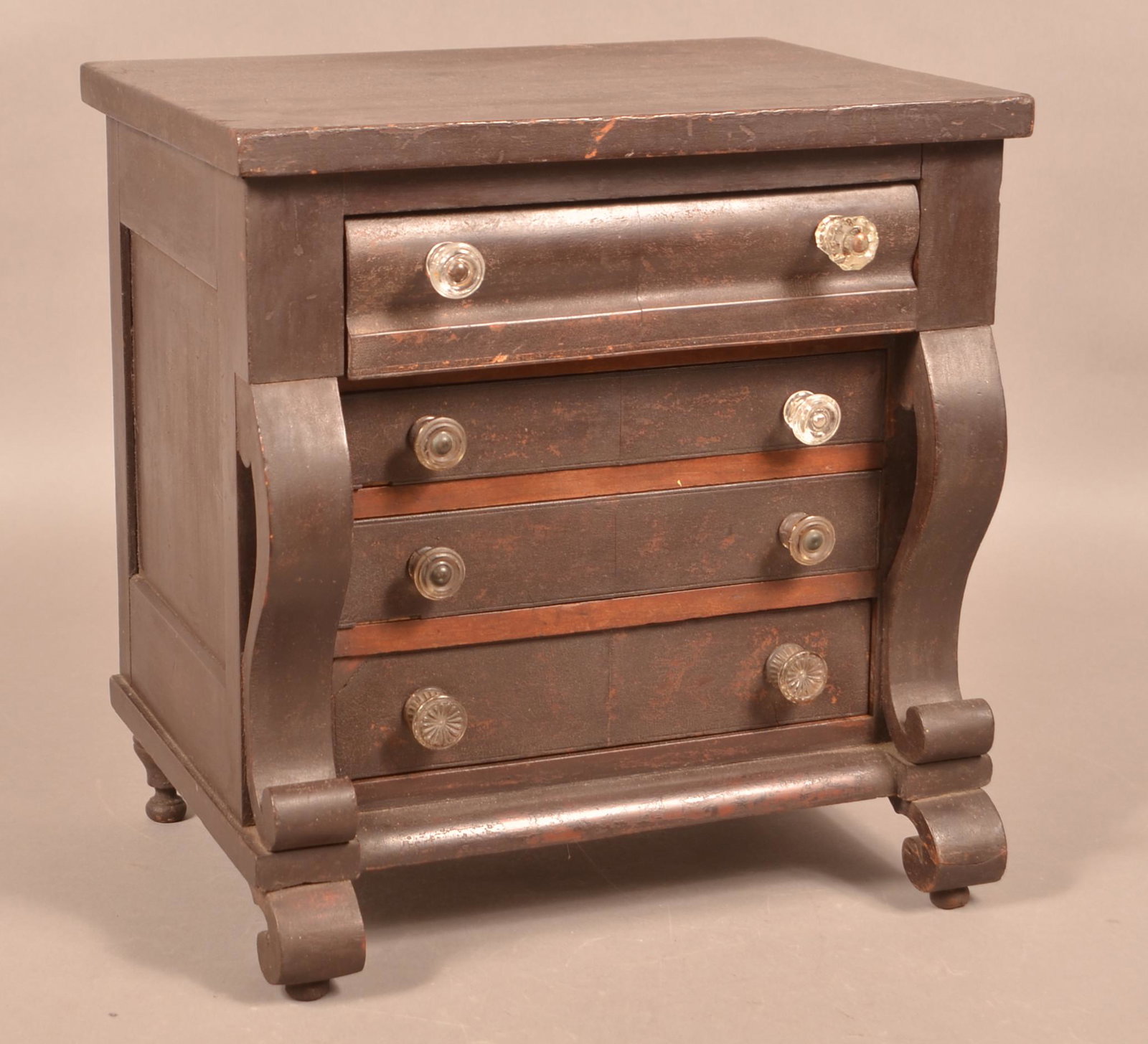 Empire Miniature Cherry & Mahogany Chest of Drawers.: American Empire Miniature Cherry and Mahogany Veneer Chest of Drawers. Ogee molded full width upper drawer above three full width beaded dovetailed graduated drawers, paneled sides, scrolled styles an