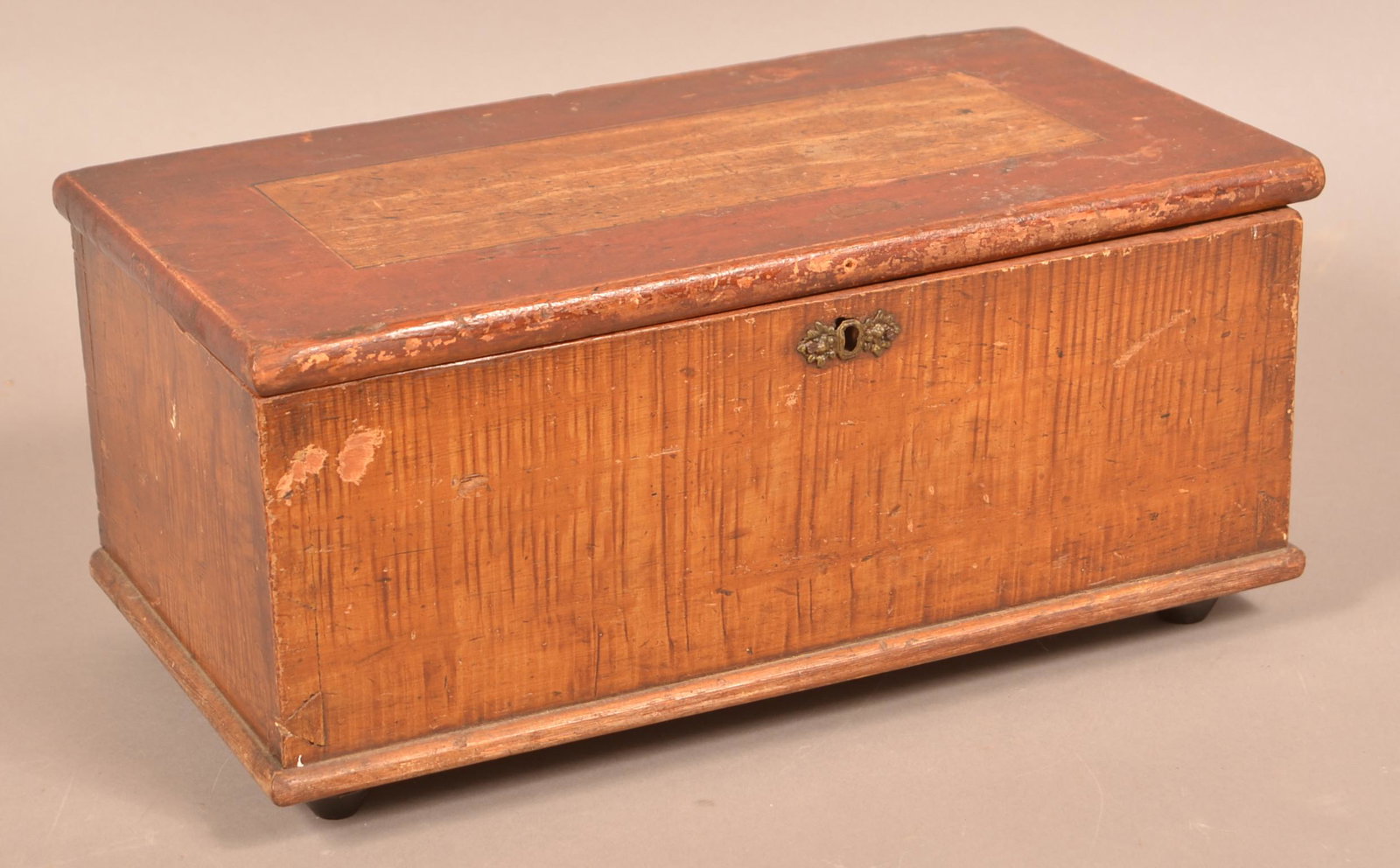 Pennsylvania 19th Century Softwood Trinket Chest.: Pennsylvania 19th Century Softwood Trinket Chest. Original red and grain paint decoration. Dovetailed case with turned feet. 7"h. x 15-1/4"w. x 8-1/4"d. Condition: Good with wear and split repair at o