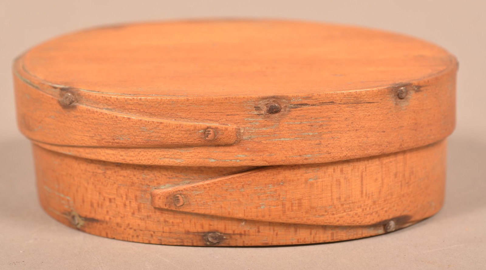 19th Century Small Oval Bentwood Pantry Box.: 19th Century Small Oval Bentwood Pantry Box. Lapped finger joints supported by copper tacks. 1-5/8"h. x 4-7/8"w x 3-1/2"d. Condition: Good with use wear.
