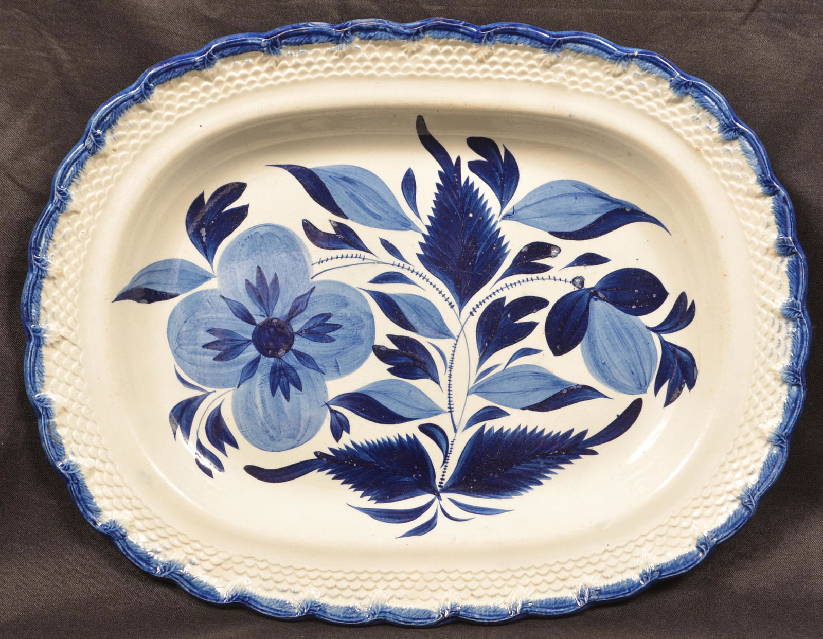 Leeds Soft Paste China Blue Feather Edge Platter.: Leeds Soft Paste China Blue Feather Edge Platter. Bold floral and foliate central decoration with fern and scale embossed border. 15-3/8"w. Condition: Very good.