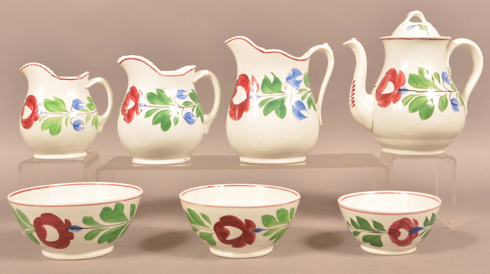 Seven Pieces of Late Adams rose Ironstone China.: Seven Pieces of Late Adams Rose Ironstone China. Including a coffee pot, 3 graduated pitchers and 3 graduated bowls. Coffee pot measures 8-1/2"h. Condition: Very good.