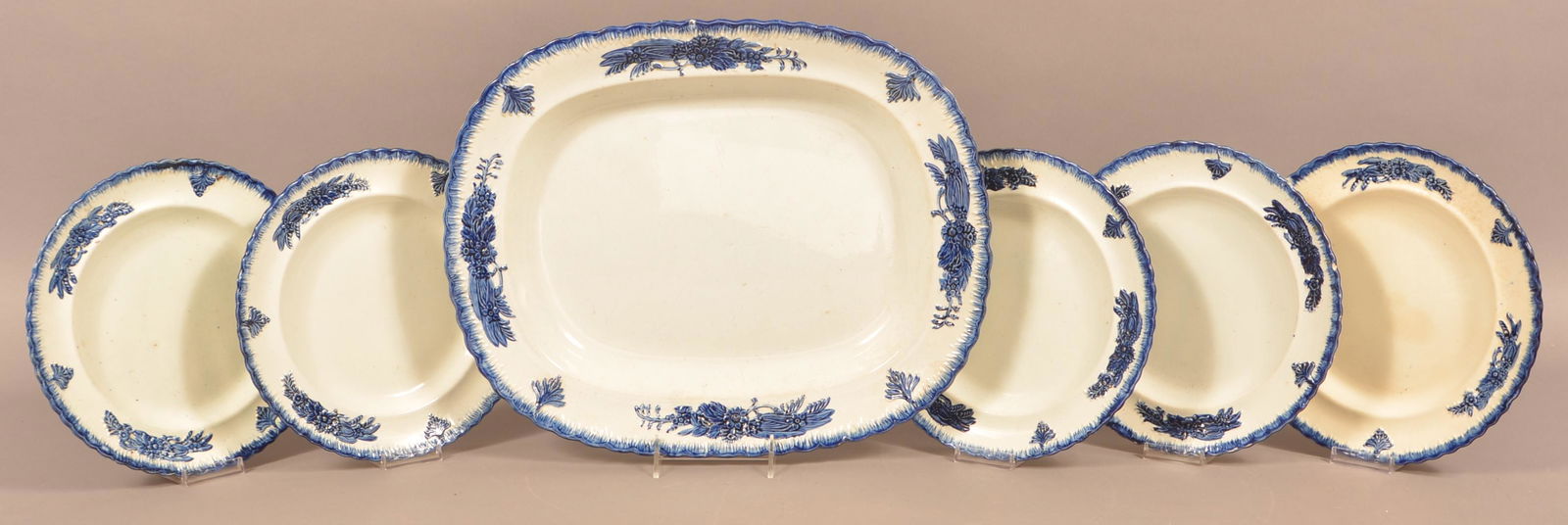 Six Pieces of Leeds Blue Feather Edge Soft Paste China.: Six Pieces of Leeds Blue Feather Edge Soft Paste China. With matching floral and foliate embossed borders. 17" platter and five 10" plates. Condition: Good with a couple of minor chips.