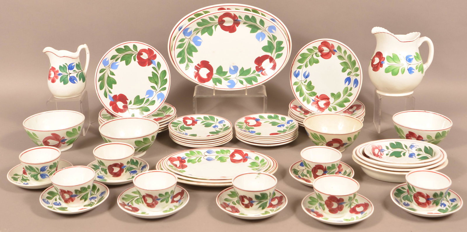 55 Pieces of Late Adams Rose ironstone China.: 55 Pieces of Late Adams Rose Ironstone China. Including pitchers, platters, plates, bowls, cups and saucers. Condition: Very good with minor damage.