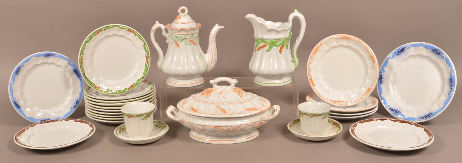 25 Pieces of White Ironstone Lustre Wheat China.: 25 Pieces of White Ironstone Lustre Wheat China. Including a coffee pot, water pitcher, covered vegetable bowl, various plates, cups and saucers. Coffee pot measures 9-1/2"h. Condition: Very good with