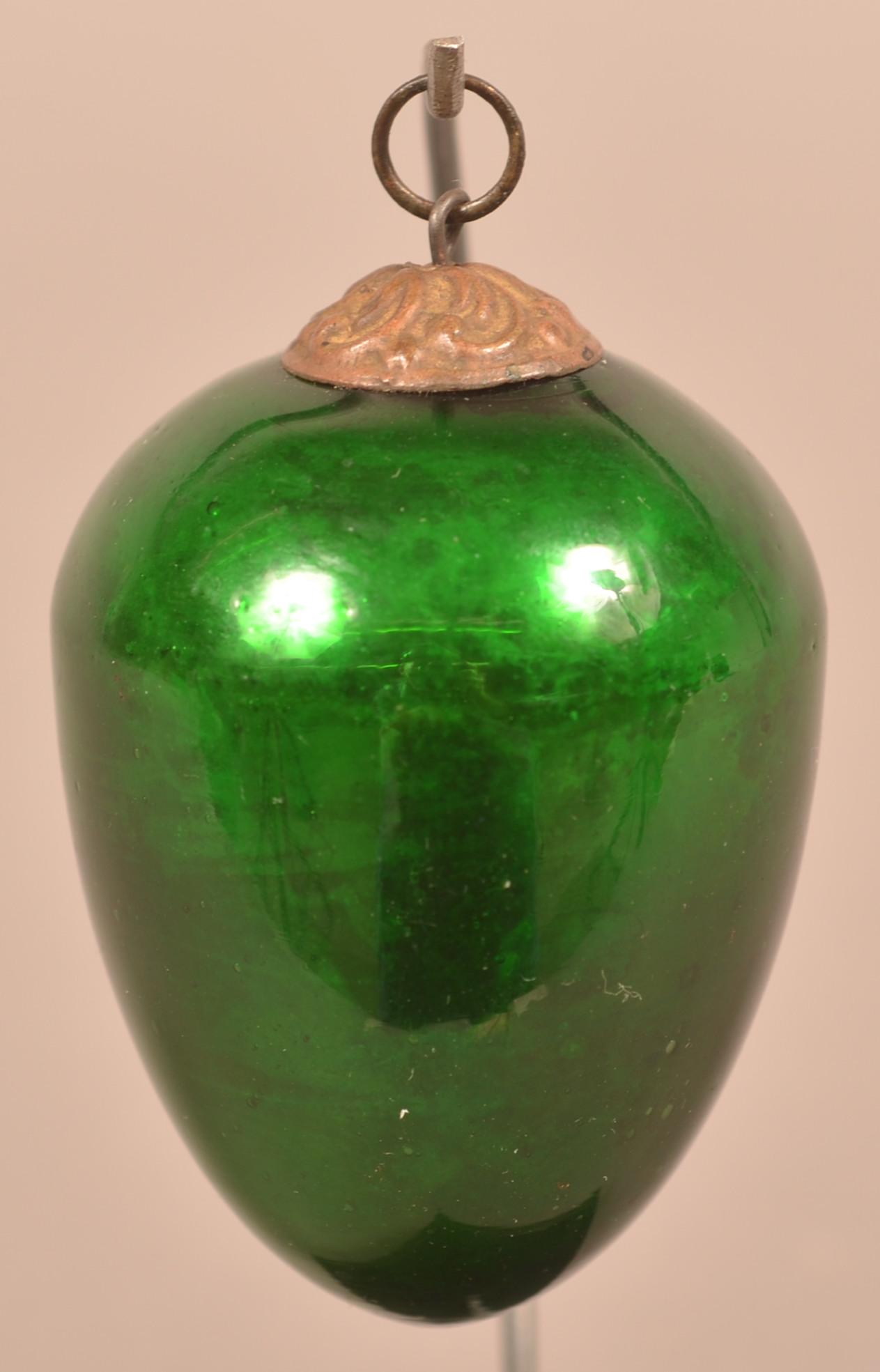 Antique German Green Glass Egg Form Kugel.: Antique German Green Glass Egg Form Kugel. Baroque cap. 2-3/4"l. Condition: Very good.