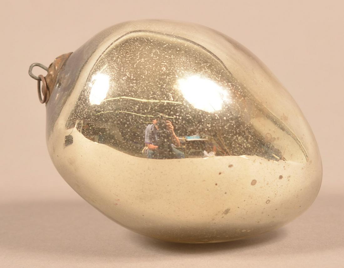 Antique German Silver Glass Egg Form Kugel.: Antique German Silver Glass Egg Form Kugel. Leaf cap. 3-1/2"l. Condition: Good with minor wear.