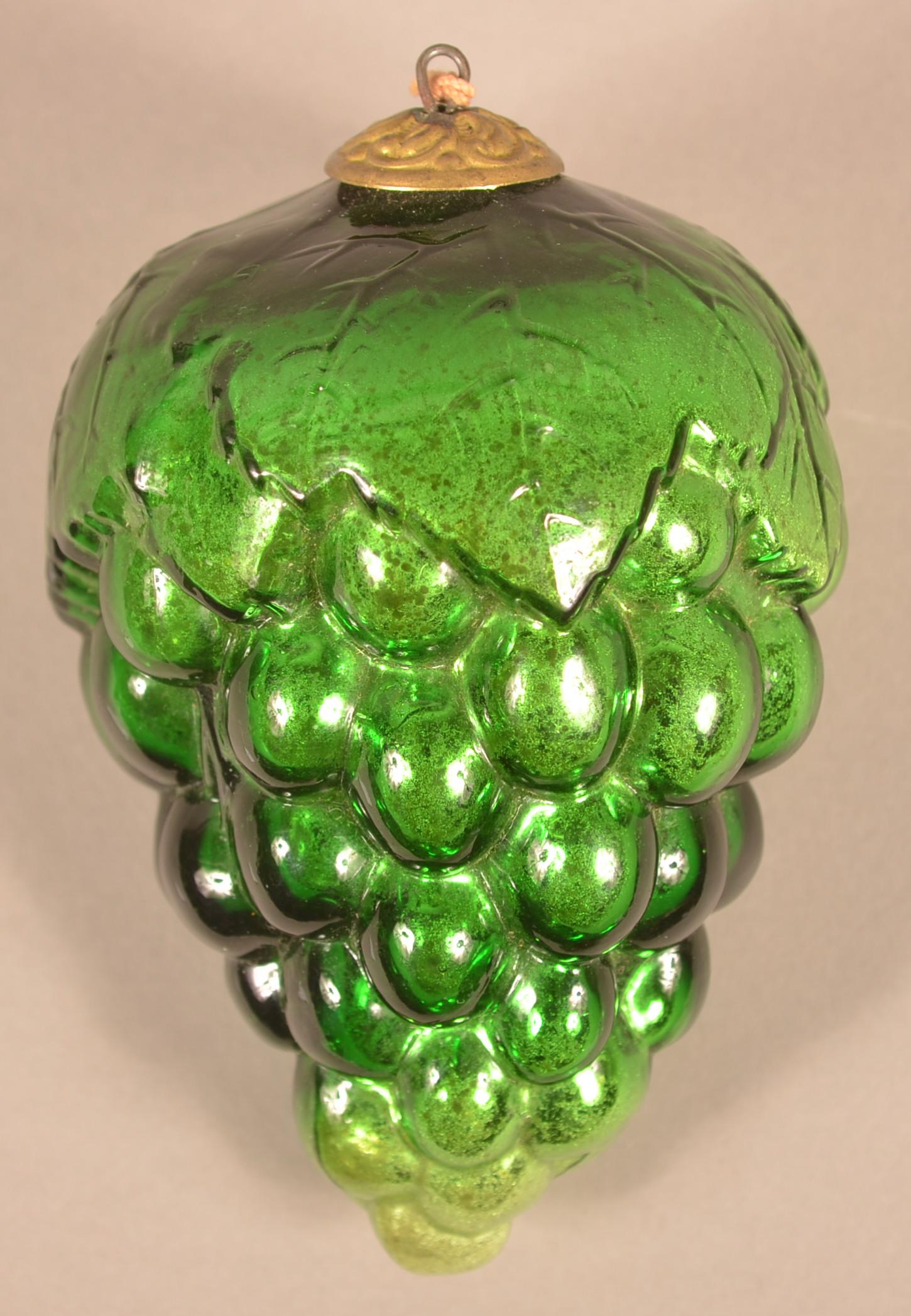 Antique French Green Glass Cluster of Grapes Kugel.: Antique French Green Glass Oval Leaf Cluster of Grapes Kugel. Embossed "Depose" on top. (French registry mark). Baroque cap. 5-1/2"l. Condition: Very good.