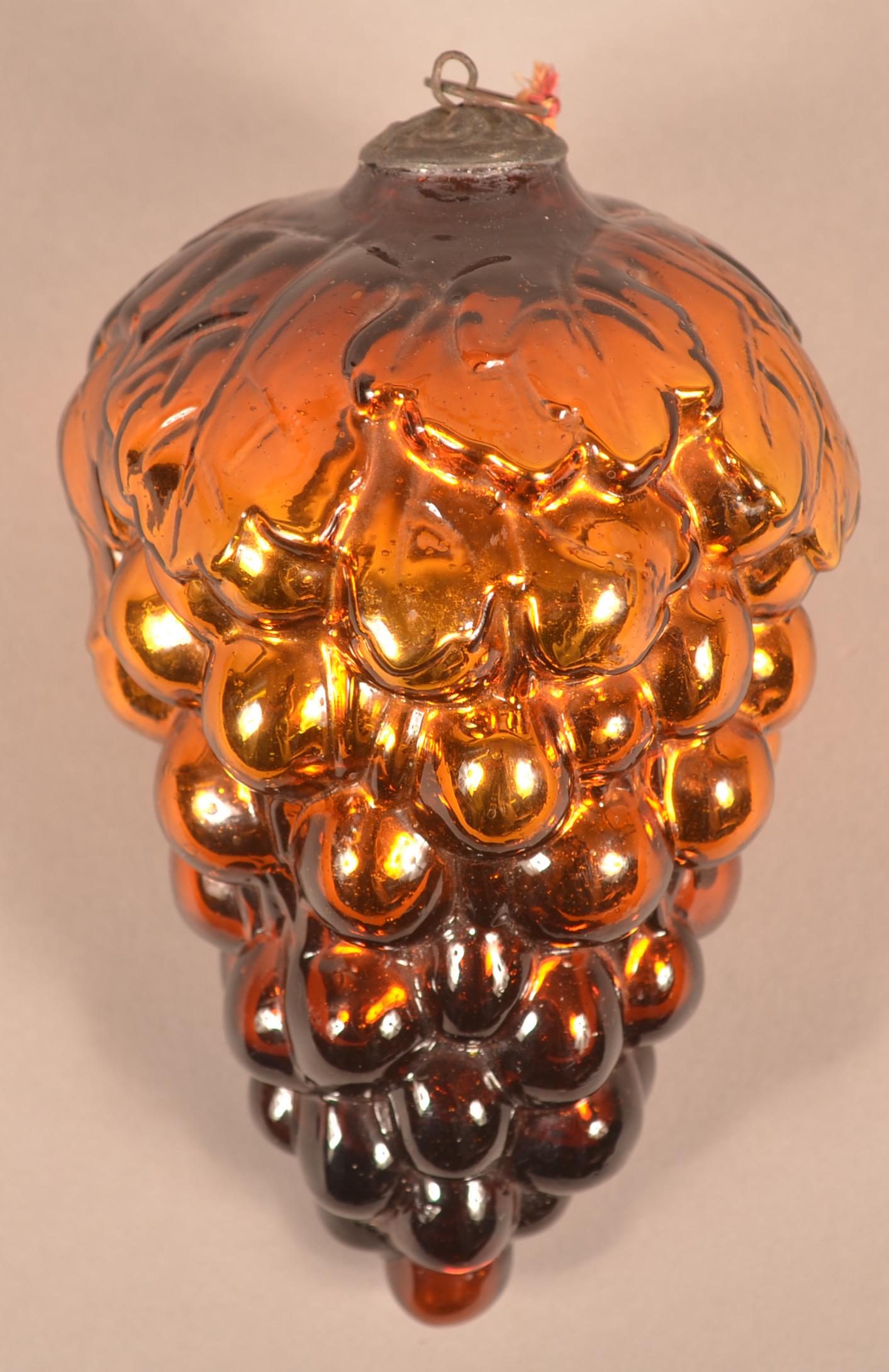 Antique German Amber Glass Cluster of Grapes Kugel.: Antique German Amber Glass Oval Leaf Cluster of Grapes Kugel. Baroque cap. 6"l. Condition: Very good.