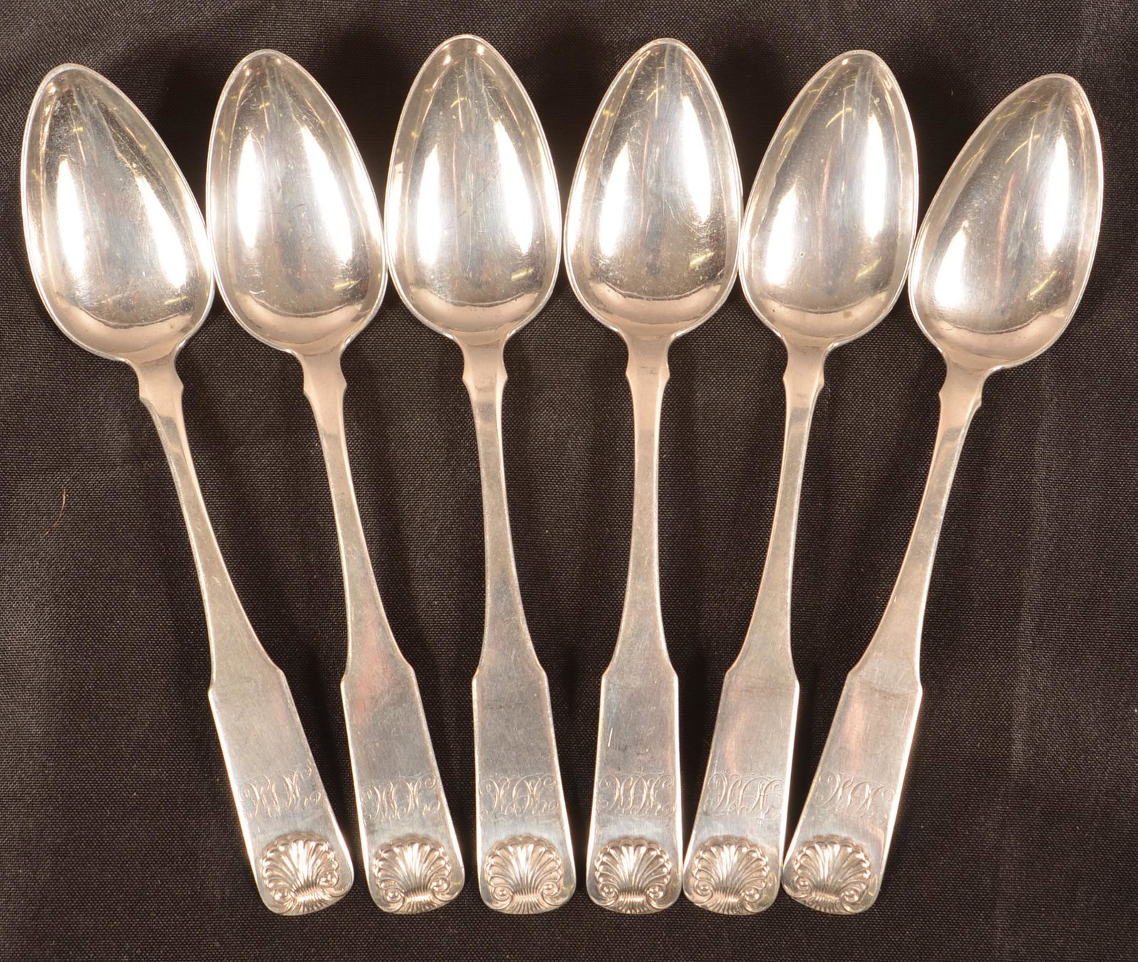 Set of Six J.B. Jones, Boston, MA Coin Silver Spoons.: Set of Six J.B. Jones, Boston, MA Coin Silver Spoons. Circa. 1782-1854. Shell handles. Monogrammed. 7-1/4"l. Condition: Very good.