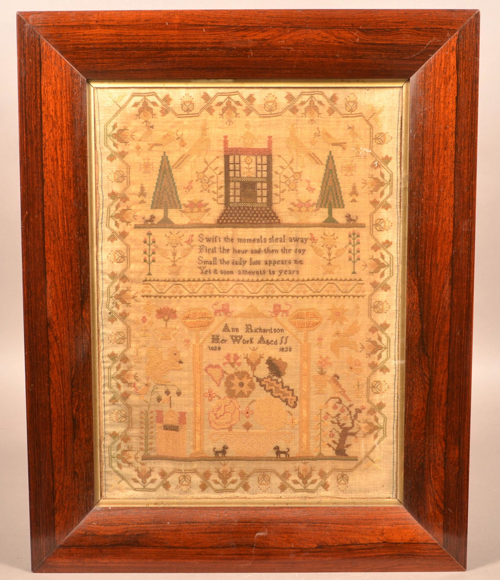 Ann Richardson 1828 Needlework Verse Sampler.: Ann Richardson 1828 Needlework Verse Sampler. With altar, lions, dogs, birds, squirrel and potted flowers. Strawberry vine border. In an antique faux rosewood frame, 23-1/2" x 18-3/4" overall. Conditi