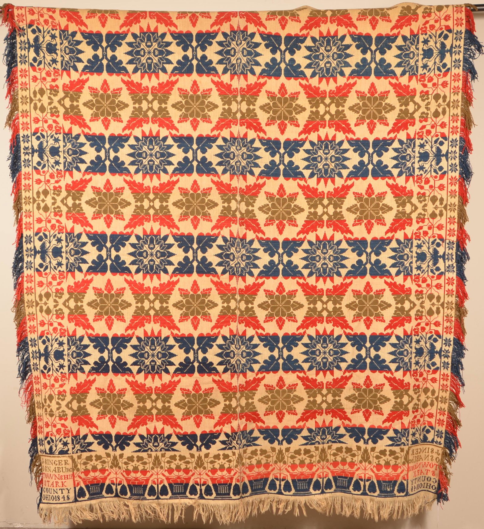 1848 Stark County, Ohio Two Part Jacquard Coverlet.: Stark County, Ohio 1848 Four-Color Two-Part Jacquard Coverlet. Signed "J. Singer, Osnaburg Township, Stark County, Ohio 1848". 72" x 82" not including fringe. Condition: Good with wear.