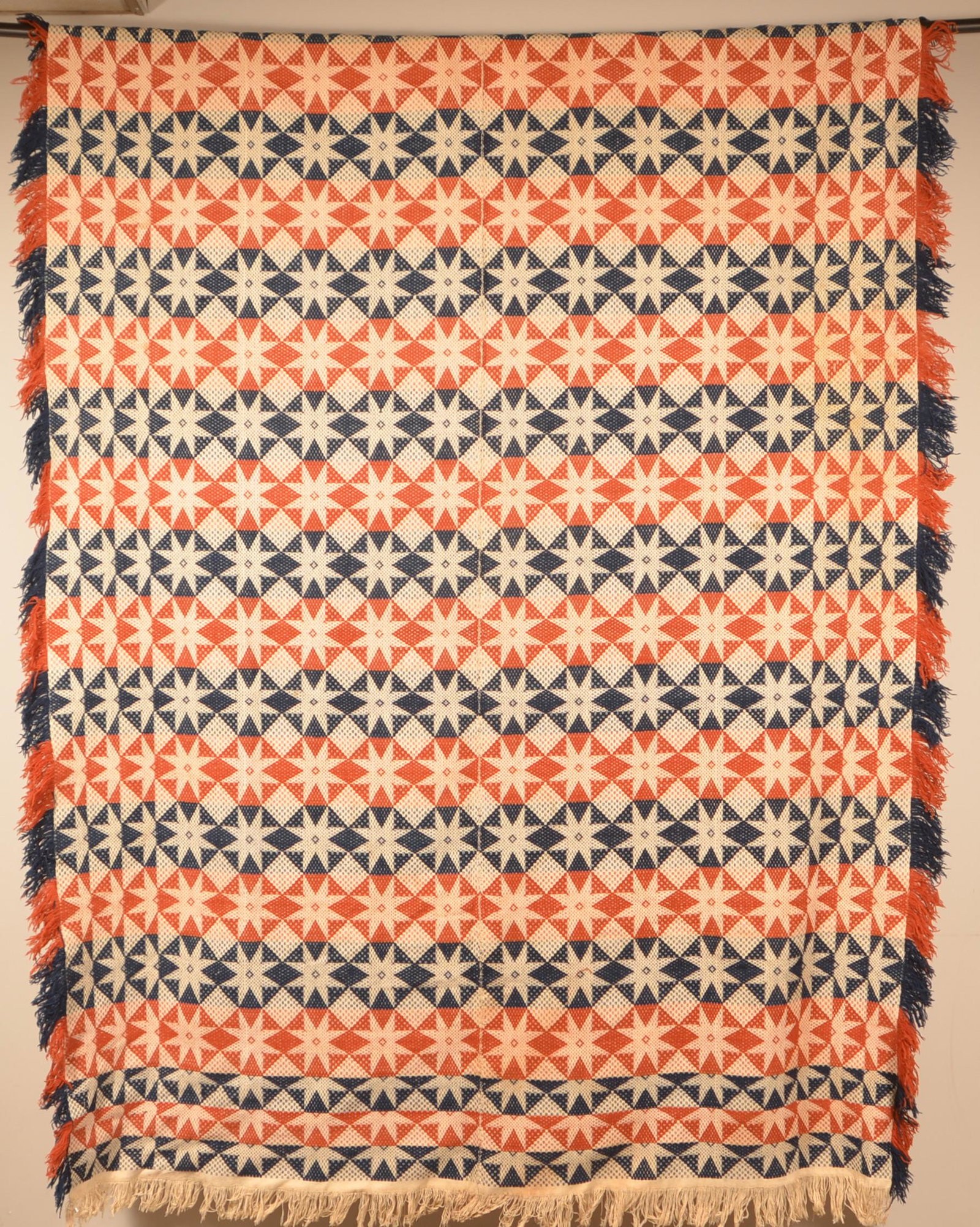 Antique Three Color Two Part Woven Jacquard Coverlet.: Mid 19th Century Three-Color Two-Part Woven Jacquard Coverlet. Unsigned. Geometric star design with alternating colors. 72" x 96" not including fringe. Condition: Very good.