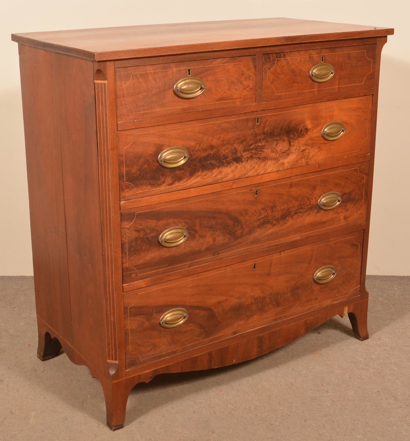Pennsylvania Hepplewhite Walnut Chest of Drawers.: Pennsylvania Hepplewhite Walnut Chest of Drawers. Inlaid top, two split upper and three full-width beaded line inlaid graduated dovetailed drawers, chamfered line inlaid corners, bowed skirt with Fren