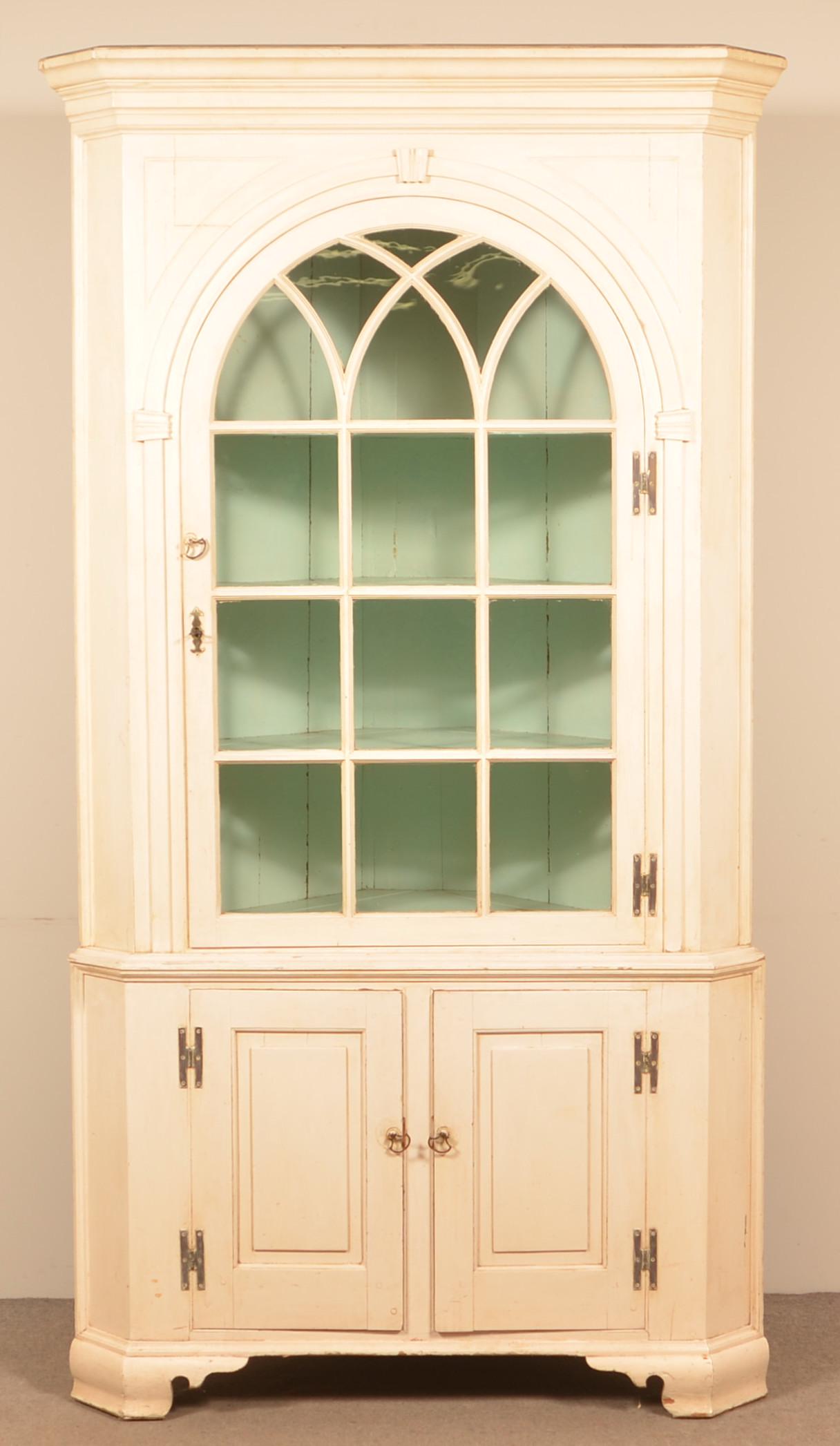 Pennsylvania Chippendale Two part Corner Cupboard.: Pennsylvania Chippendale Two-Part Corner Cupboard. Ogee molded cornice, single arched glazed upper door, two lower raised panel doors, molded base with ogee bracket feet. 86"h. x 47"w. x 24"d. Conditi