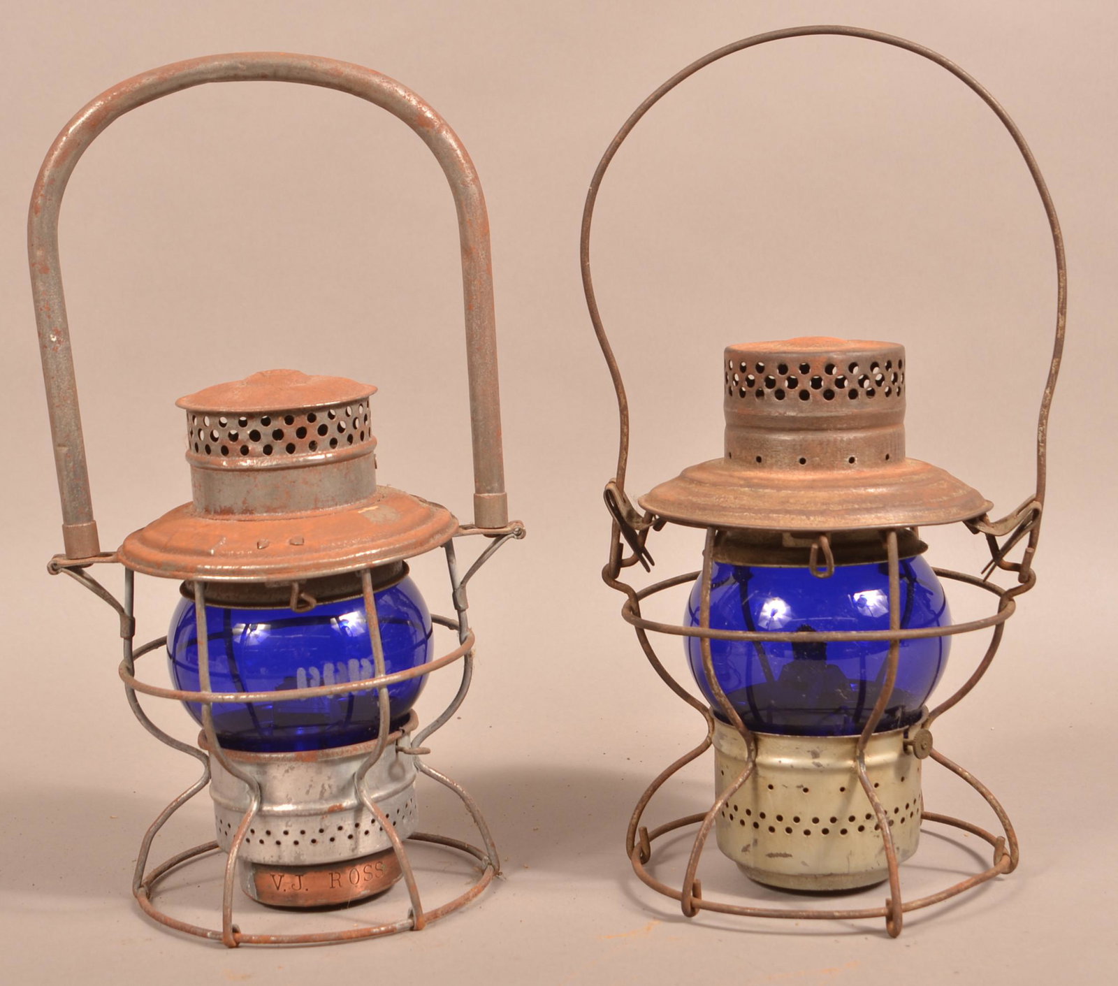 Two Vintage Pennsylvania Railroad Lanterns.: Two Vintage Pennsylvania Railroad Lanterns. Both with blue glass globes. Handlan and Adams Westlake. 8-1/4"h. and 9-1/4"h., not including handle. Condition: Good with use wear and rust.