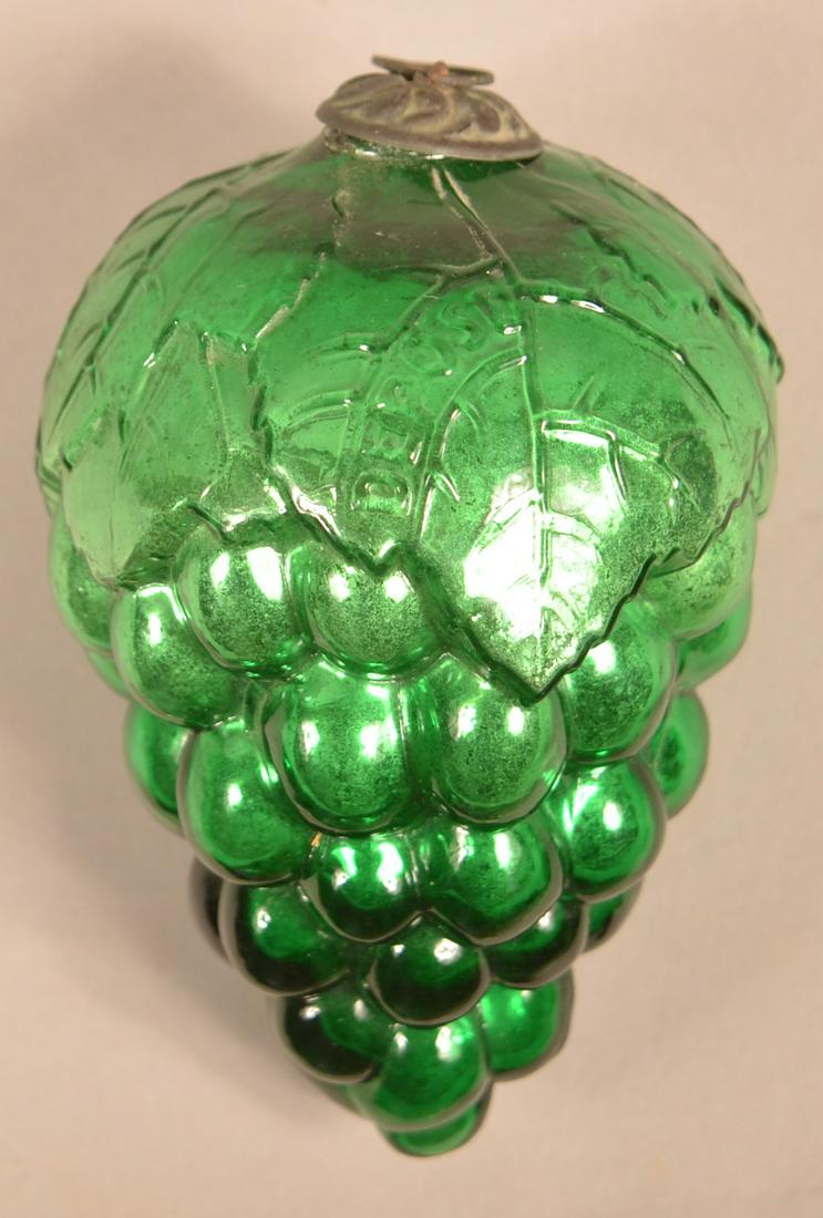 French Green Glass Oval Leaf Cluster of Grapes Kugel.: Antique French Green Glass Oval Leaf Cluster of Grapes Kugel. Embossed "Depose" on top. (French registry mark). Baroque cap. 5"l. Condition: Very good