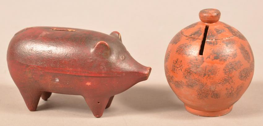 Two Antique Redware Still Banks.: Two Antique Redware Still Banks. Dome bank with manganese sponge decoration, 3-1/2"h. and a pig form bank, 6"l. Condition: Very good with a few tiny chips.