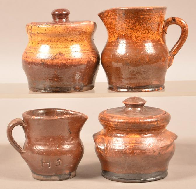 Two Sets of Schofield Redware Cream and Sugars.: Two Sets of Schofield Redware Cream and Sugars. Henry Schofield, Cecil County, MD, early 20th century. One sugar bowl and one cream pitcher is incised "H.S." on the side. Tallest piece measures 4"h. C