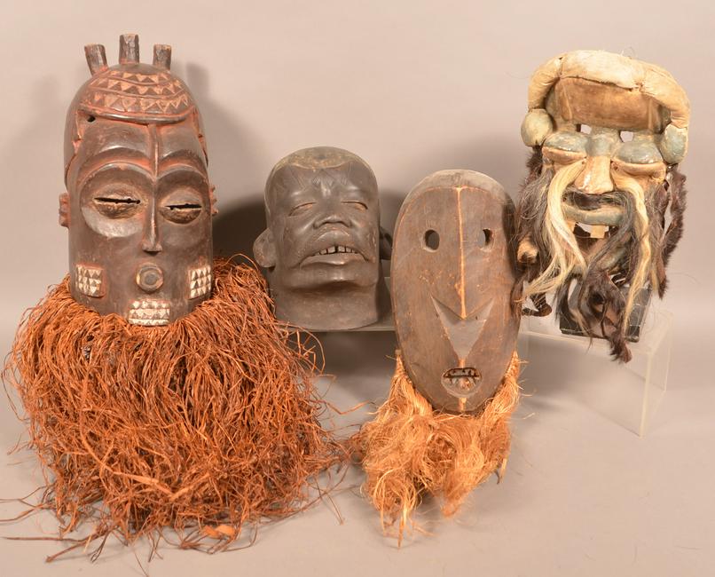 4 Antique/Vintage African Carved Wood Tribal Masks.: Four Antique/Vintage African Carved Wood Tribal Masks. Tallest measures 16"h. Condition: Good with wear and minor loss.