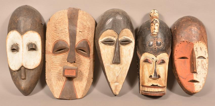 5 Antique/Vintage African Carved Wood Tribal Masks.: Five Antique/Vintage African Carved Wood Tribal Masks. Tallest measures 17"h. Condition: Good with wear and minor loss.