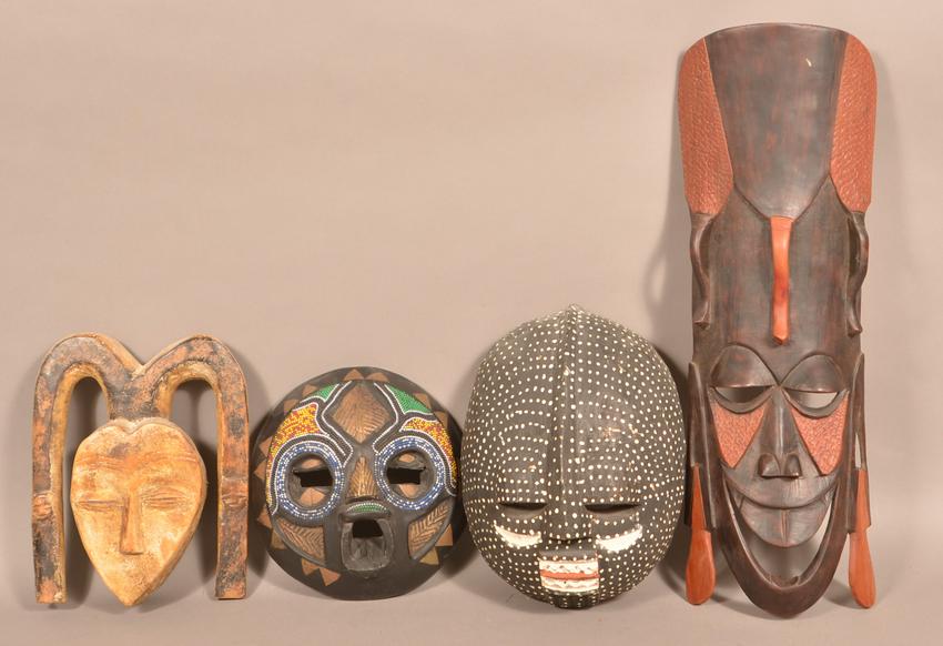 4 Antique/Vintage African Carved Wood Tribal Masks.: Four Antique/Vintage African Carved Wood Tribal Masks. Tallest measures 17"h. Condition: Good with wear and minor loss.