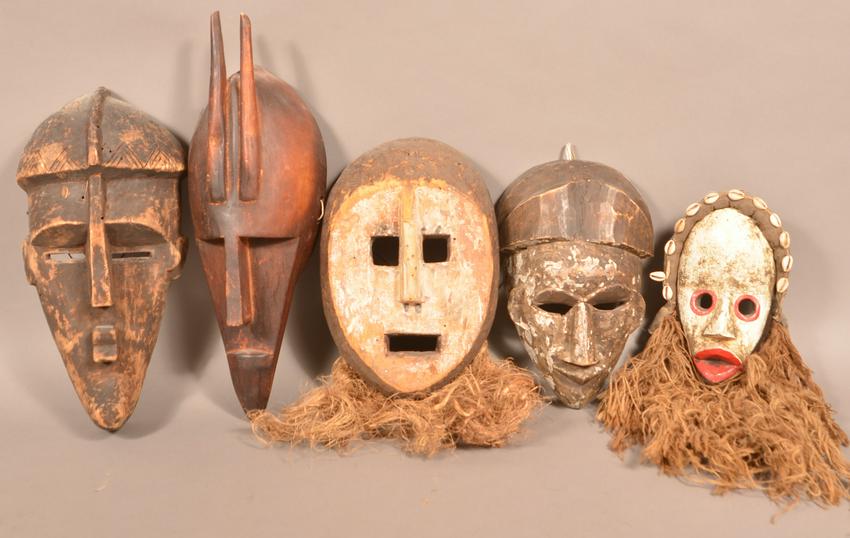 5 Antique/Vintage African Carved Wood Tribal Masks.: Five Antique/Vintage African Carved Wood Tribal Masks. Tallest measures 20"h. Condition: Good with wear and minor loss.