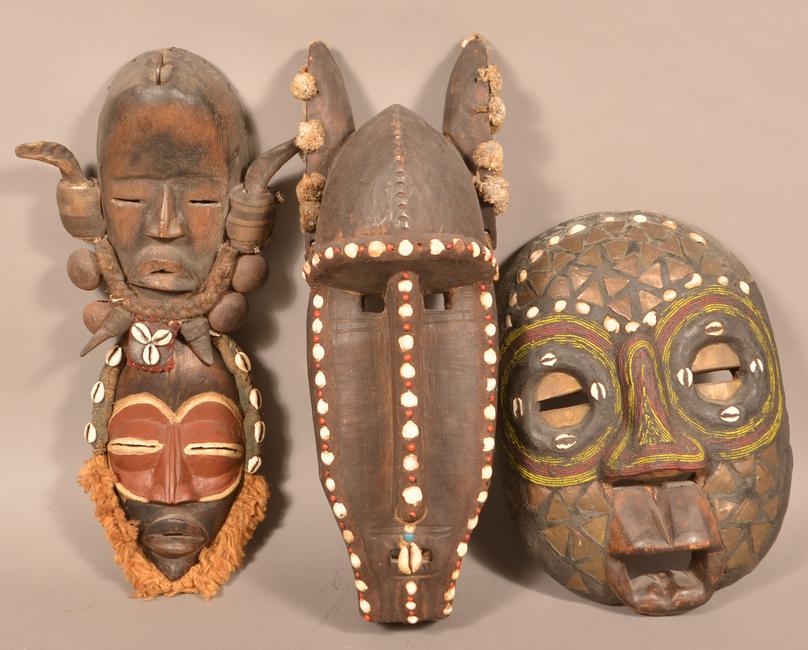 4 Antique/Vintage African Carved Wood Tribal Masks.: Four Antique/Vintage African Carved Wood Tribal Masks. Tallest measures 19"h. Condition: Good with wear and minor loss.