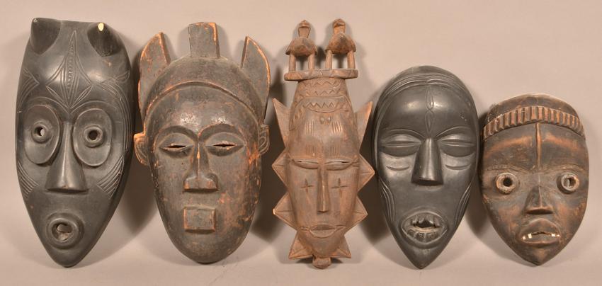 5 Antique/Vintage African Carved Wood Tribal Masks.: Five Antique/Vintage African Carved Wood Tribal Masks. Tallest measures 15"h. Condition: Good with wear and minor loss.