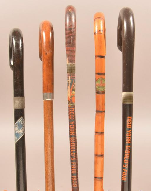 Five Vintage World's Fair Souvenir Canes.: Five Vintage World's Fair Souvenir Canes. Two 1933 Chicago and three 1939 New York. Including a New York 1939 World's Fair with pull-out map cane. Largest measures 38-1/4"l. Condition: Good with wear