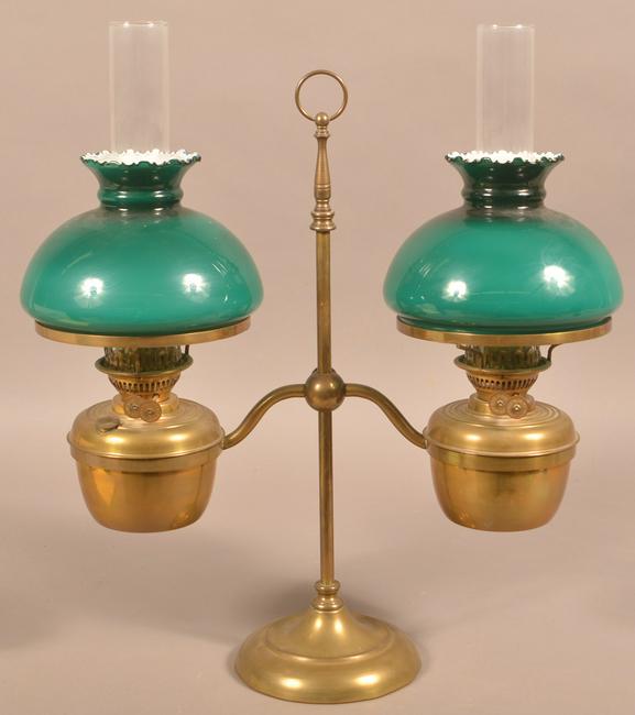 Brass Double Arm Student Lamp with Green Shades.: Antique Brass Double Arm Student Lamp with Green Overlay Glass Shades. Wick adjusters signed " John Scott, Made in England". 22"h. Condition: Good with minor wear.