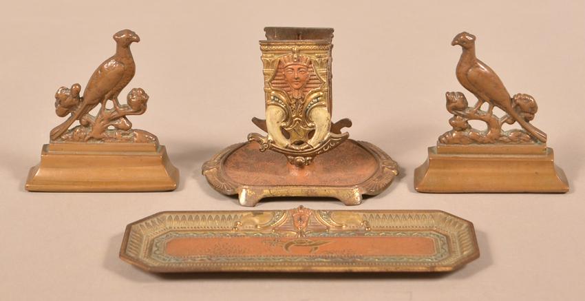 Bronzed Cast Iron Match Holder and Tray.: Bronzed Cast Iron Match Holder and Tray. Cast with pharaonic masks over scimitars. Along with two small cast bronze pheasant bookends. Tray measures 8-1/4"l. Condition: Good with minor wear.