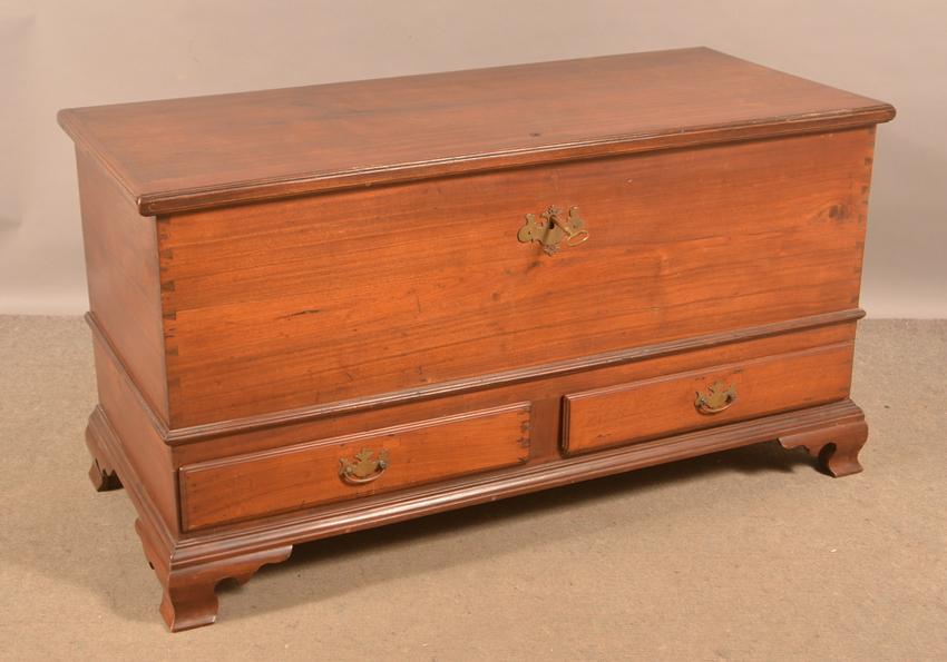 Pennsylvania Chippendale Walnut Dower Chest.: Pennsylvania Chippendale Walnut Dower Chest. Molded lid, interior with wrought iron strap hinges and jaw lock, softwood till, dovetailed case, two split lip molded dovetailed drawers, molded base with