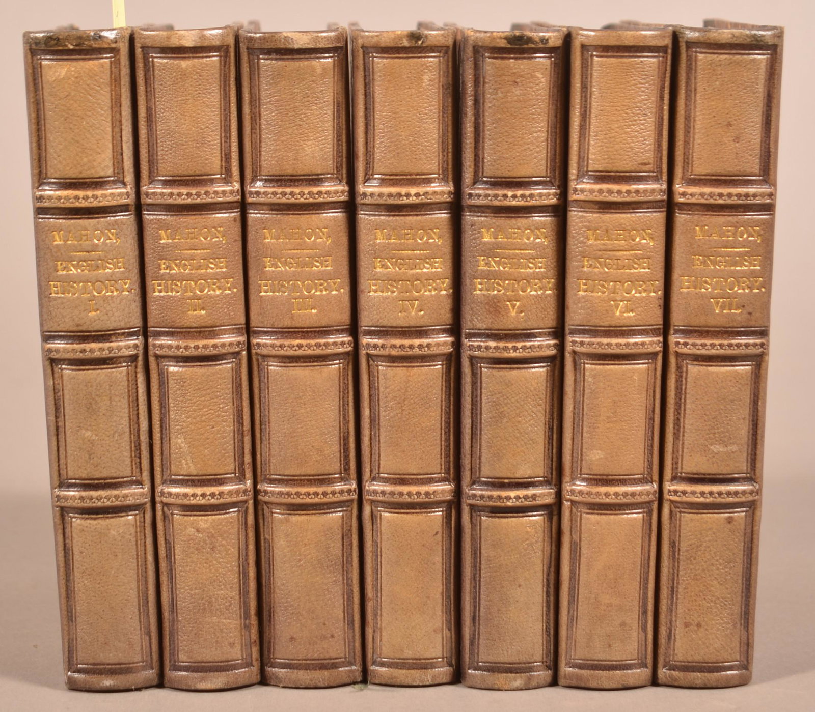 7 Volume History of England Leatherbound: The History of England. By Lord Mahon. 7 volumes, complete. Leipzig: Tauchnitz, 1853. Each volume is 4 3/4 x 6 1/4". Polished calf spine and corners/marbled boards. Spines faded, otherwise very good c