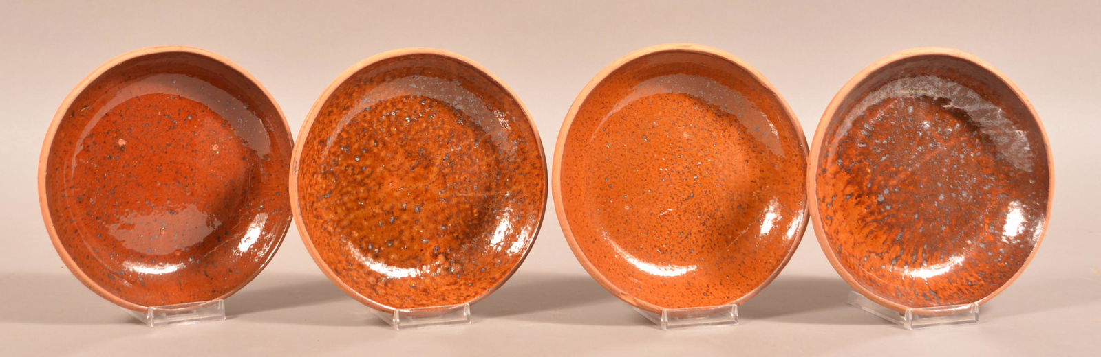 Four Glazed Redware Pottery Bowls.: Four Glazed Redware Pottery Bowls. Attributed to Medinger Pottery. 7" diam. Condition: Good.
