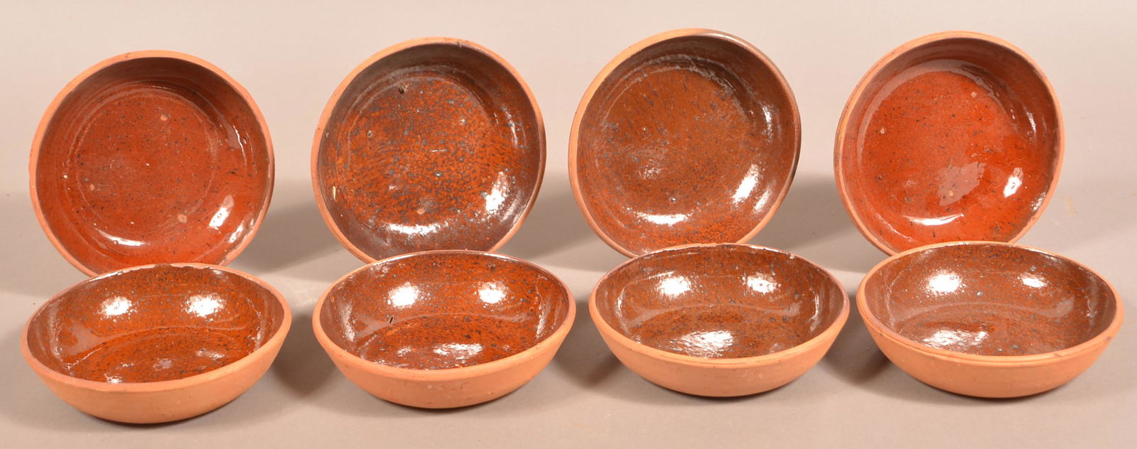 Eight Glazed Redware Pottery Bowls.: Eight Glazed Redware Pottery Bowls. Attributed to Medinger Pottery. 6" diam. Condition: Good.