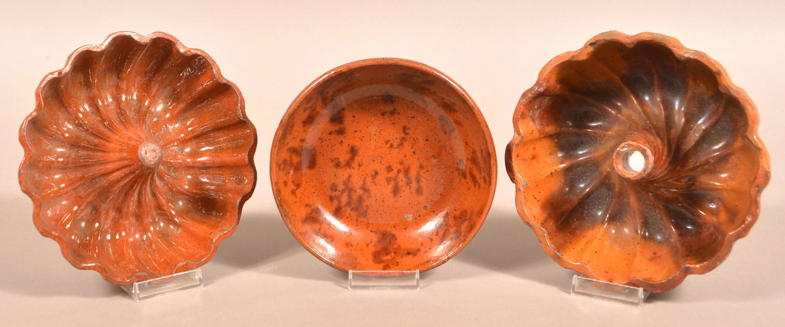 Three Pieces of Antique Mottle Glazed Redware Pottery.: Three Pieces of Antique Mottle Glazed Redware Pottery. Including a 6-3/8" diam. bowl and 2 small Turks molds, both 7-1/4" diam. Condition: Good with minor chips and wear.