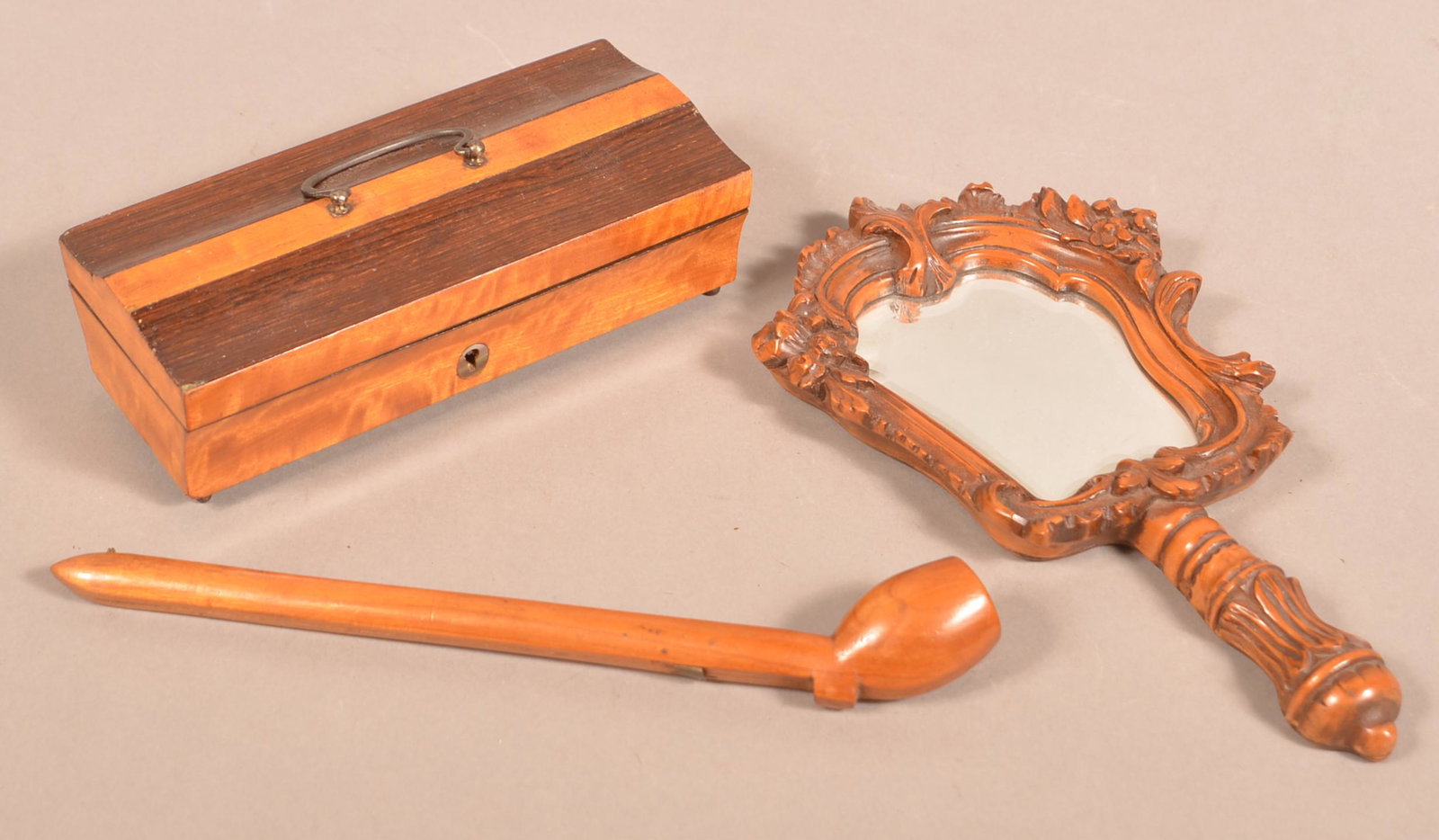 Three Pieces of Antique Woodenware.: Three Pieces of Antique Woodenware. Including wallpaper lined hinged-lid trinket box, carved hand mirror and pipe case. Pipe case measures 10-1/2"l. Tex Johnson Collection. Condition: Good with some w
