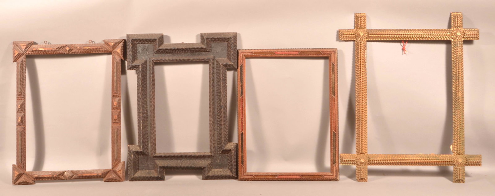 Four Antique Tramp Art Picture Frames.: Four Antique Tramp Art Picture Frames. Largest measures 27" x 33" overall. Condition: Good with wear and losses.
