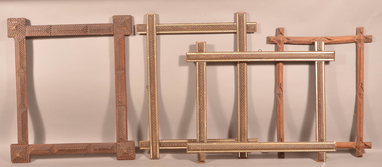 Four Antique Tramp Art Picture Frames.: Four Antique Tramp Art Picture Frames. Largest measures 29 x 33" overall. Condition: Good with wear and losses.