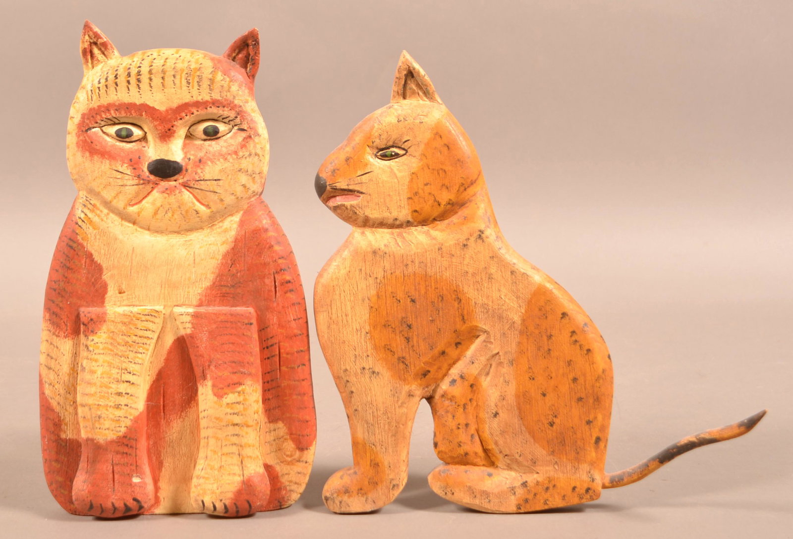 2 Gottshall Folk Art Carved Wood Cat Door Stops.: Two Contemporary Folk Art Carved and Painted Cat Door Stops. Signed "June & Walter Gottshall". Tallest 13"h. Condition: Good with minor wear.