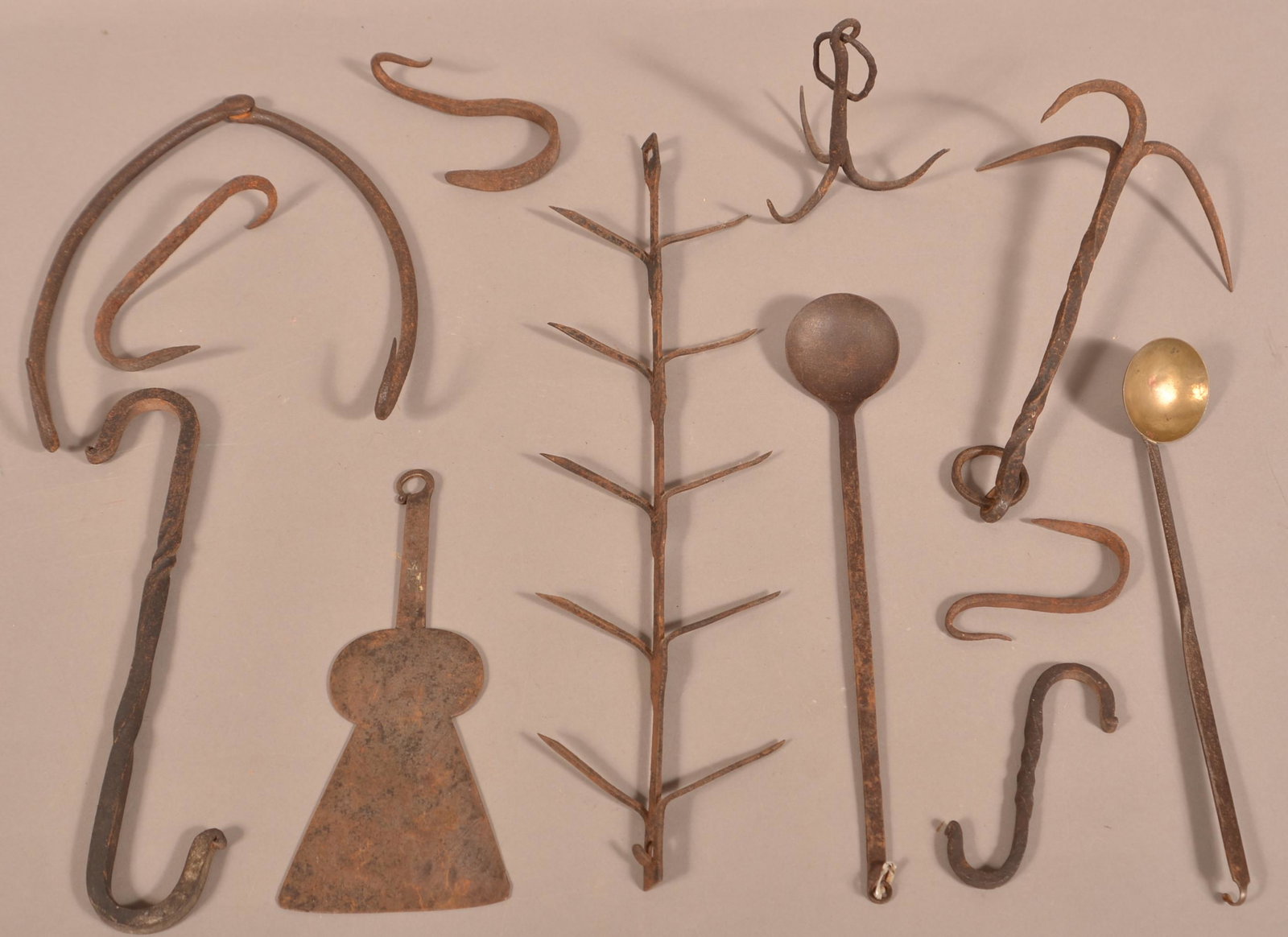 19th Century Wrought Iron Utensil and Hearth items.: Lot of 19th Century Wrought Iron Utensil and Hearth items. Corn dryer measures 19-1/4"l. Condition: Good with rust and wear.