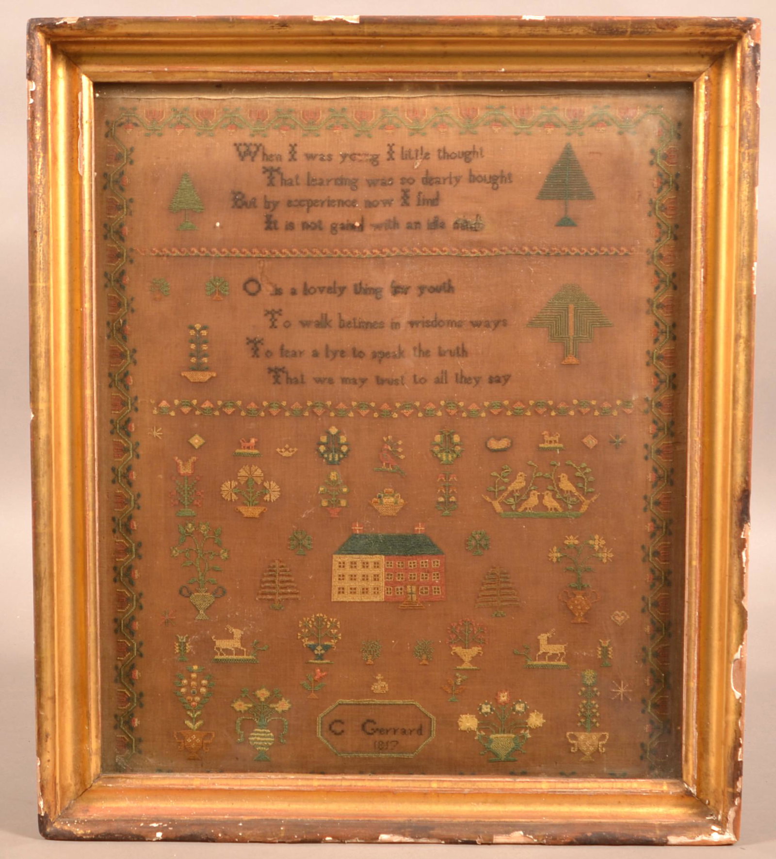 C. Garrard 1857 Pictorial Needlework Sampler.: C. Garrard 1857 Pictorial Needlework Sampler. With verse, house, animals and potted flowers. In a gilt molded frame 21" x 18" overall. Condition: Fair with major darkening, frame has numerous losses.